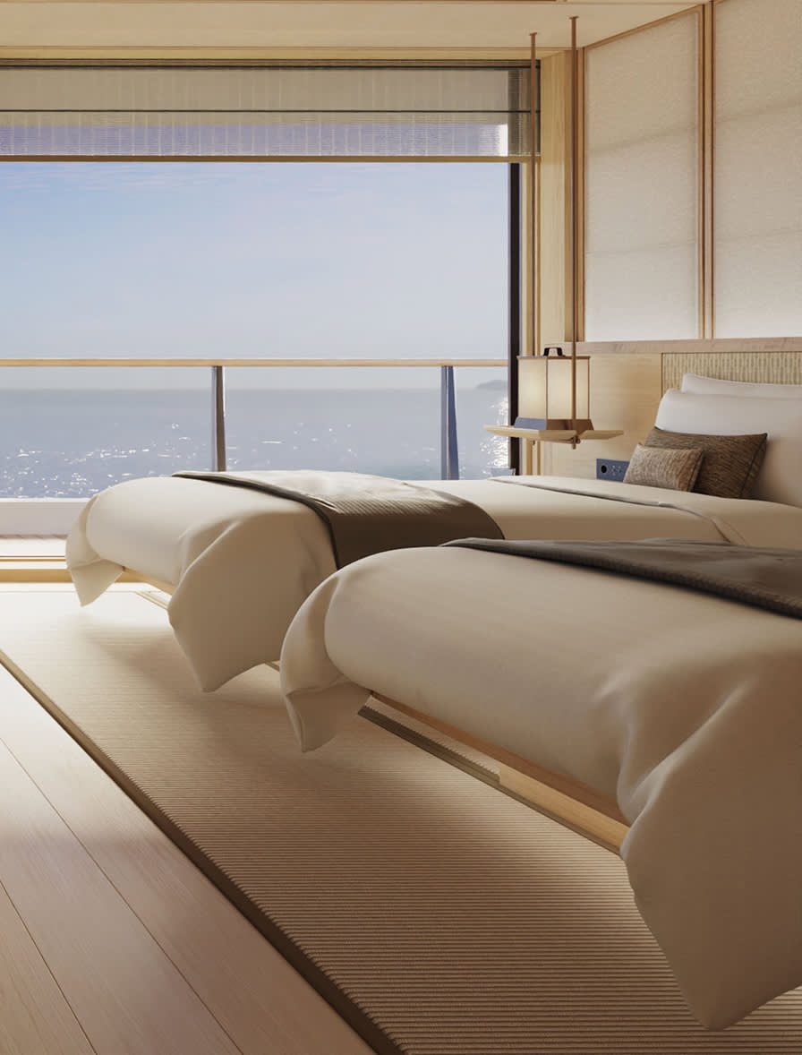 Amangati Deluxe Suite 臥室與落地窗海景