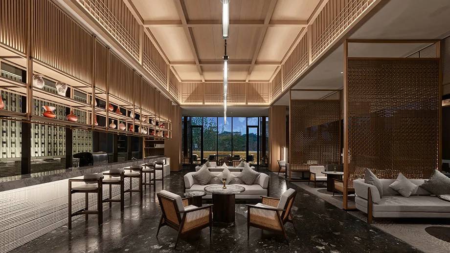 東莞松山湖悅榕庄 Lobby Lounge 的挑高書牆與沙發區