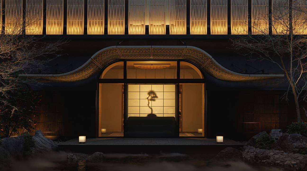 京都嘉佩樂酒店夜間點燈的建築入口與庭院