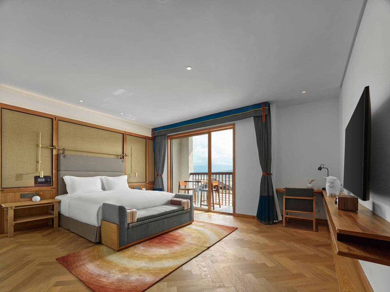 香格里拉 LUX* 酒店 Junior Suite 的臥室與陽台